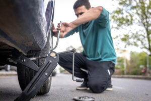 Car broken down on roadside with warning triangle placed behind across Florida, Georgia, Alabama, and Tennessee